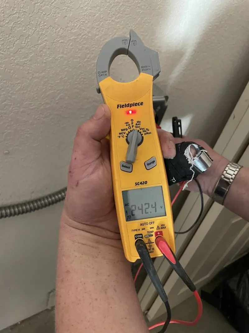 Voltage testing with clamp meter during Electrical Installation Services in Laureles